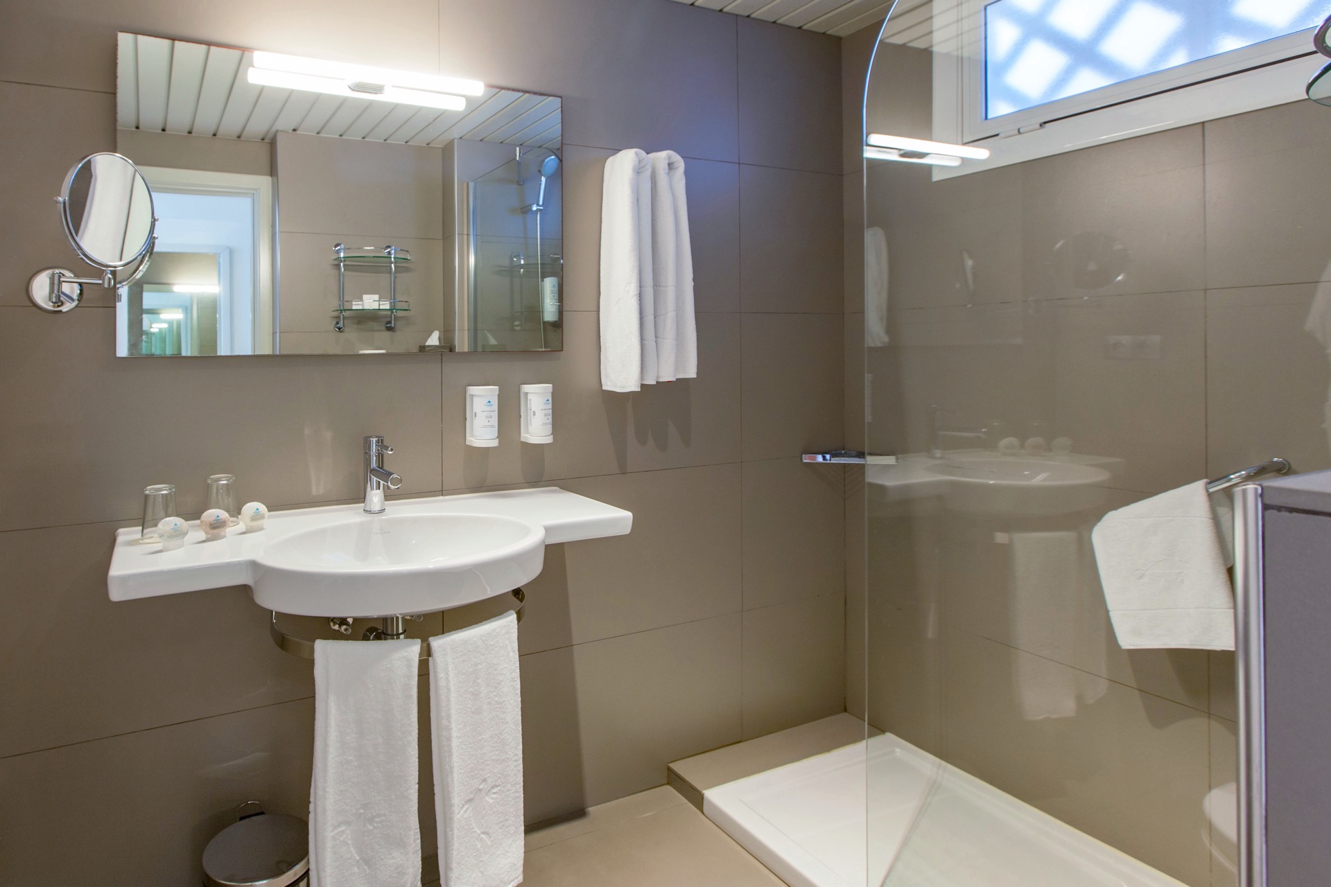 bathtroom double standard room corallium beach by lopesan hotels
