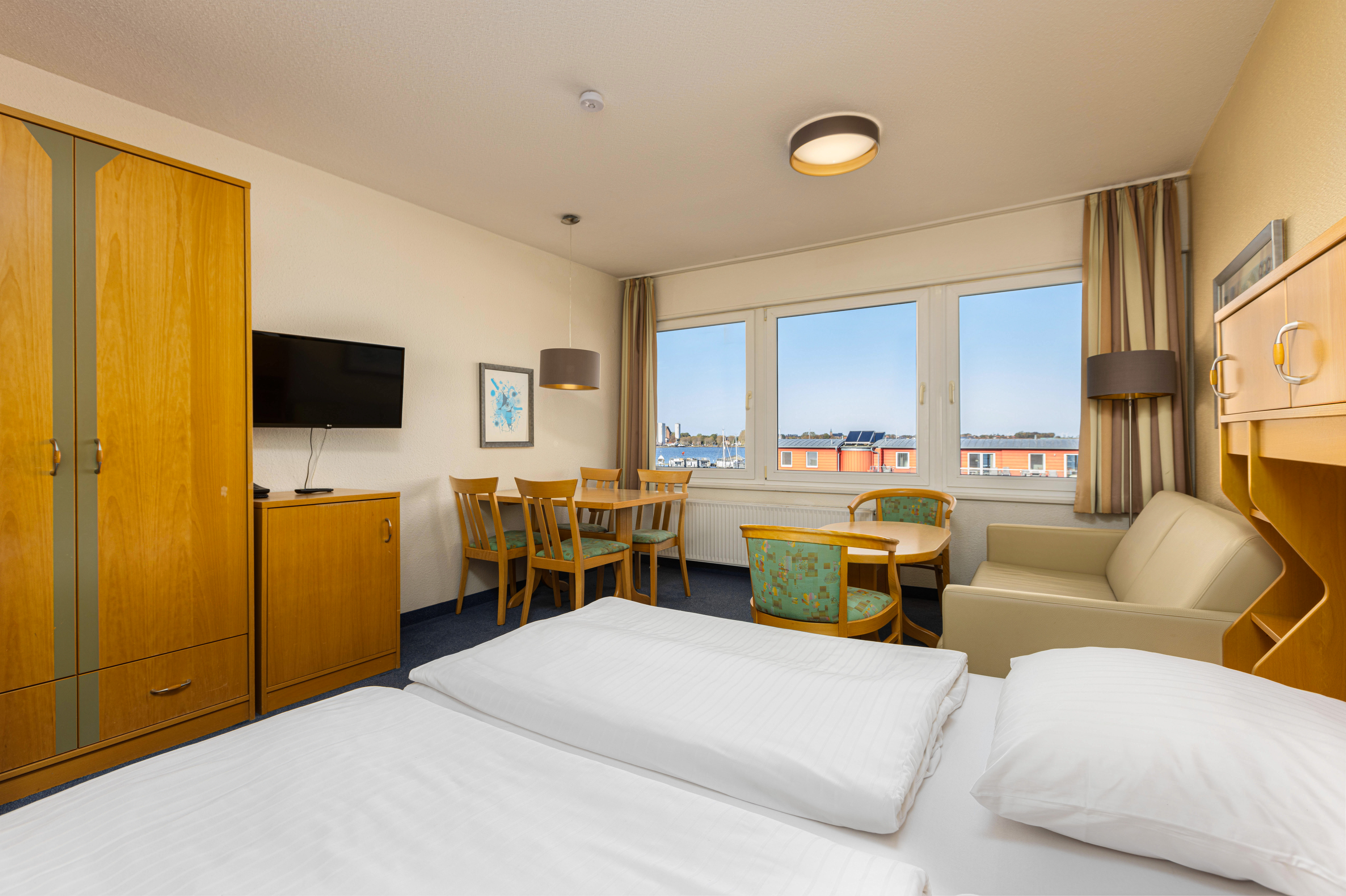 bed photos yachthafen apartment room hotel ifa fehmarn