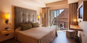 	Interior side view of the Double Standard Adapted room at the Lopesan Baobab with open terrace	