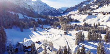 	Aerial view of IFA Breitach Hotel and snowy landscape	