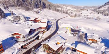 	Aerial view of the snowy landscape around IFA Alpenrose Hotel	