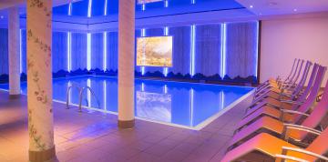 	Indoor pool and hammocks in the wellness centre at the IFA Alpenrose Hotel	
