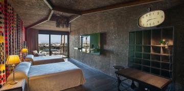 	Bedroom with two single beds in the Royal Suite at the Lopesan Baobab Resort	