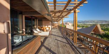 	Side view of the furnished terrace with jacuzzi of the Royal Suite at the Lopesan Baobab Resort	