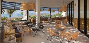 Interior view of the Corallium Dunamar by Lopesan hotels lobby with the terrace in the background