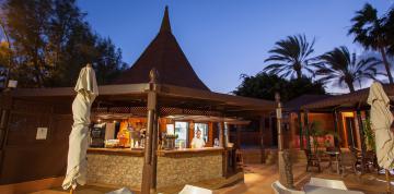 	Pool bar at dusk at the IFA Altamarena Hotel	